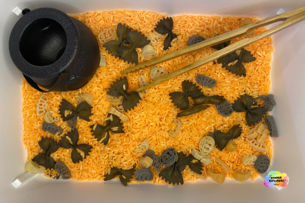 Orange and Black Halloween sensory bin using rice and pasta